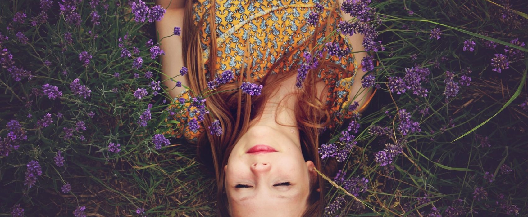 girl lying in lavender field